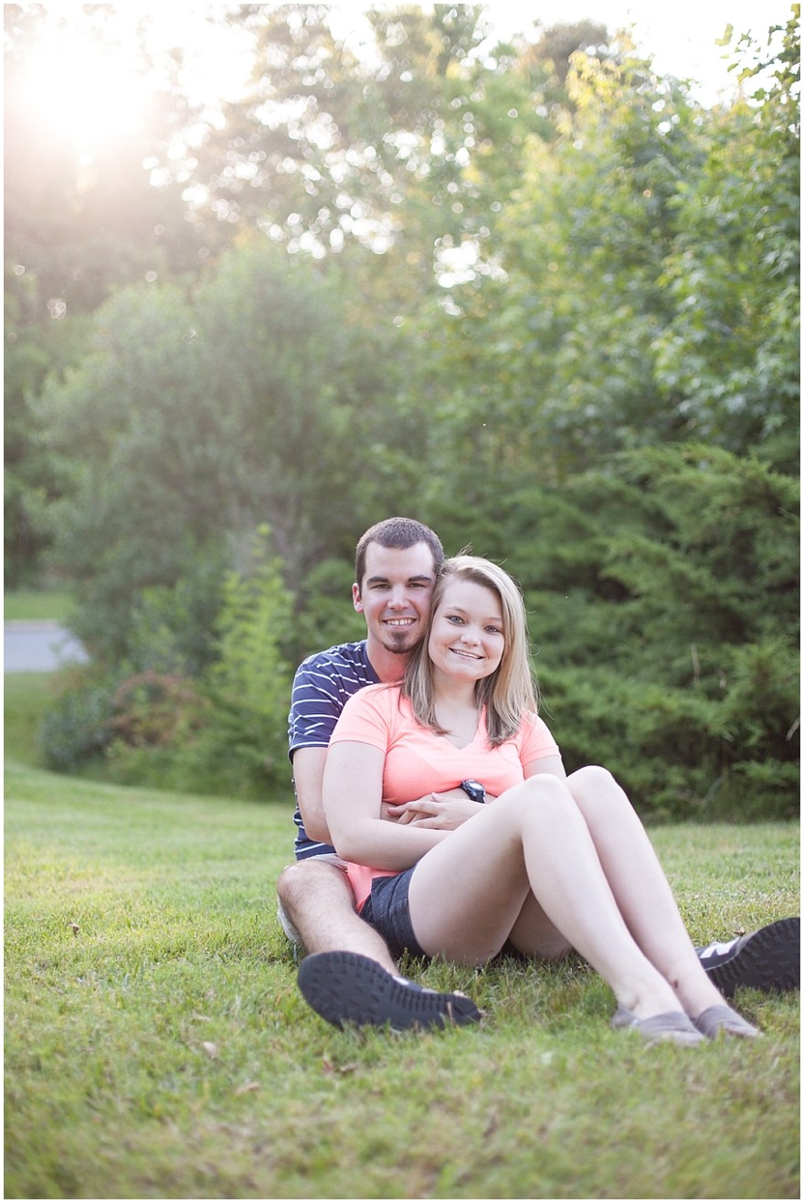 Charlotte Christ covenant church engagement photos sitting in grass