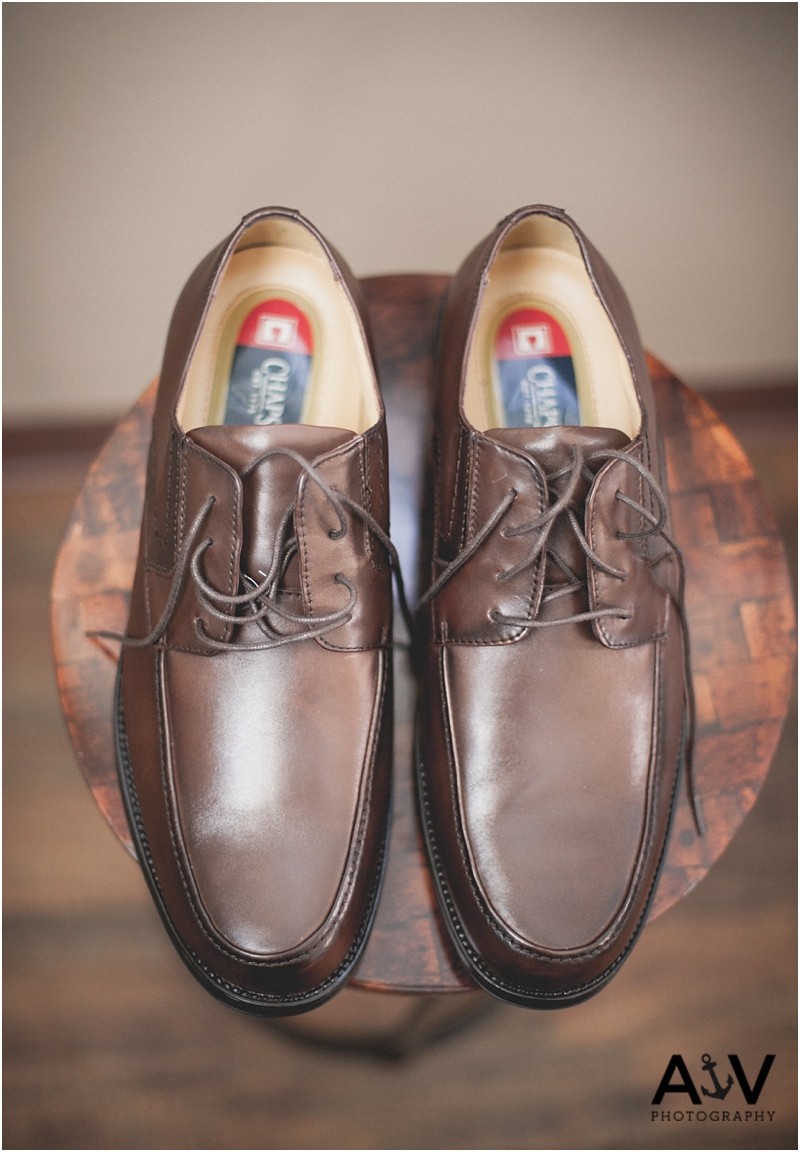 The grooms shoes as he prepares for the wedding ceremony at the Winmock at Kinderton in Winston Salem