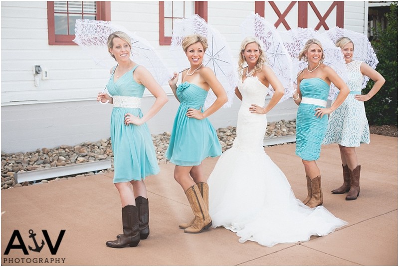 Bridesmaids with umbrellas and cowboy boots at the winmock at kinderton in WInston Salem