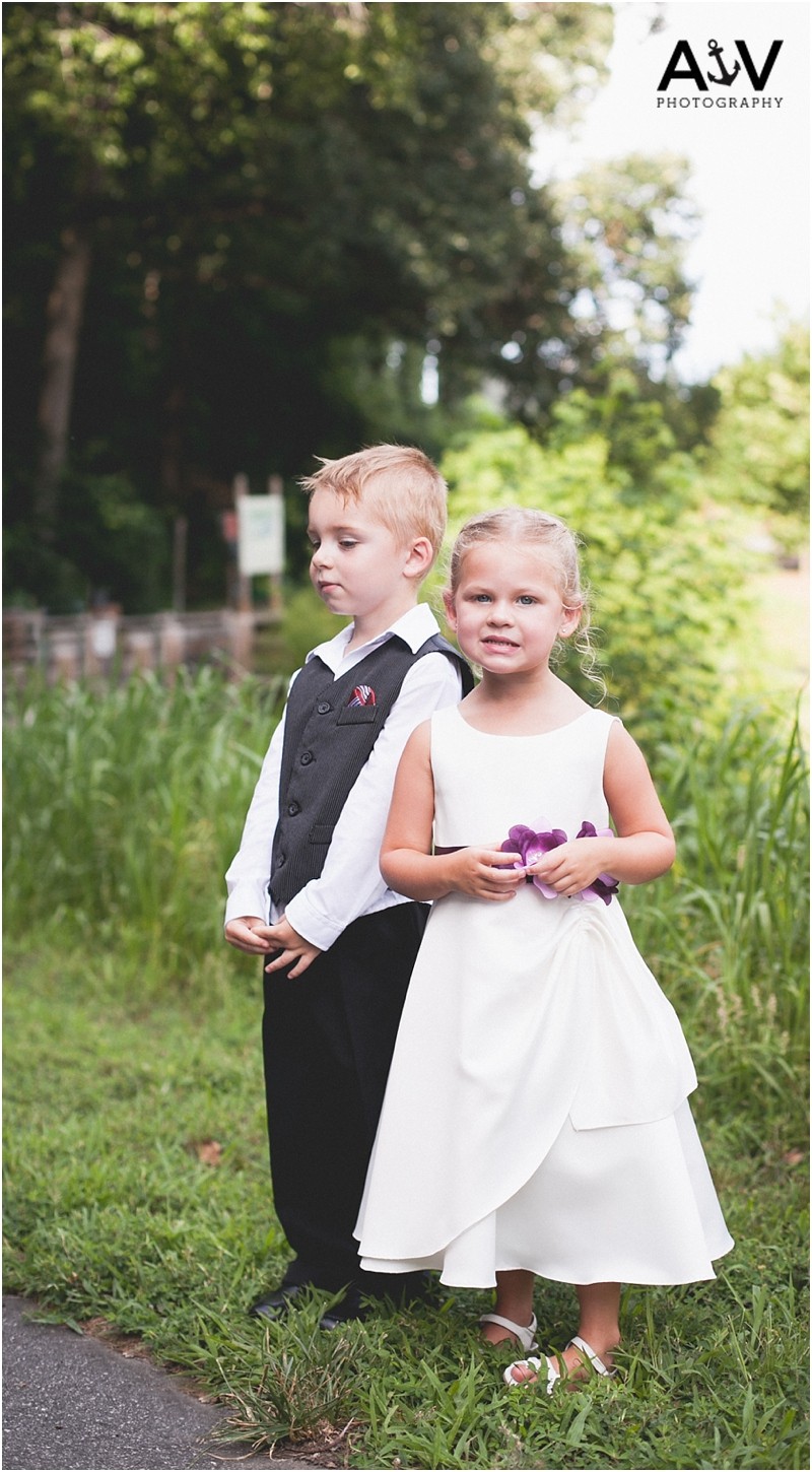 Two kids outside of the wedding ceremony at the summerfield amphitheater in North Carolina