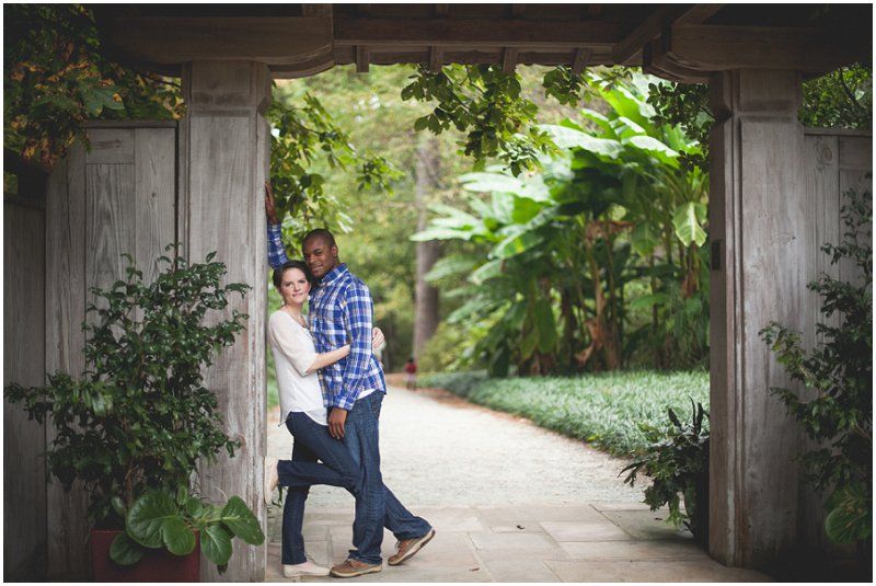 having a moment in the entrance of the thai, oriental area of the Duke Gardens during the duke gardens engagement session