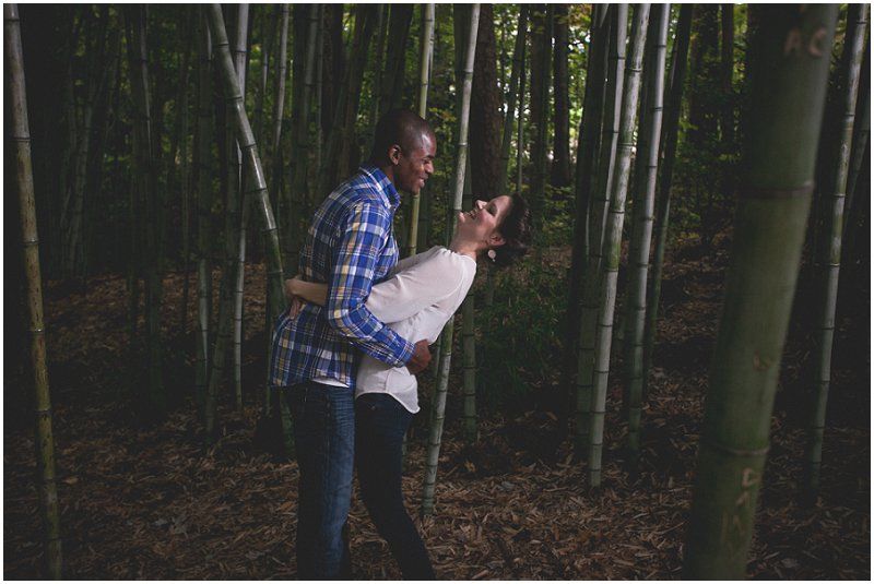 Having fun in the bamboo forest at the Duke Gardens in the engagement session at the Duke Gardens