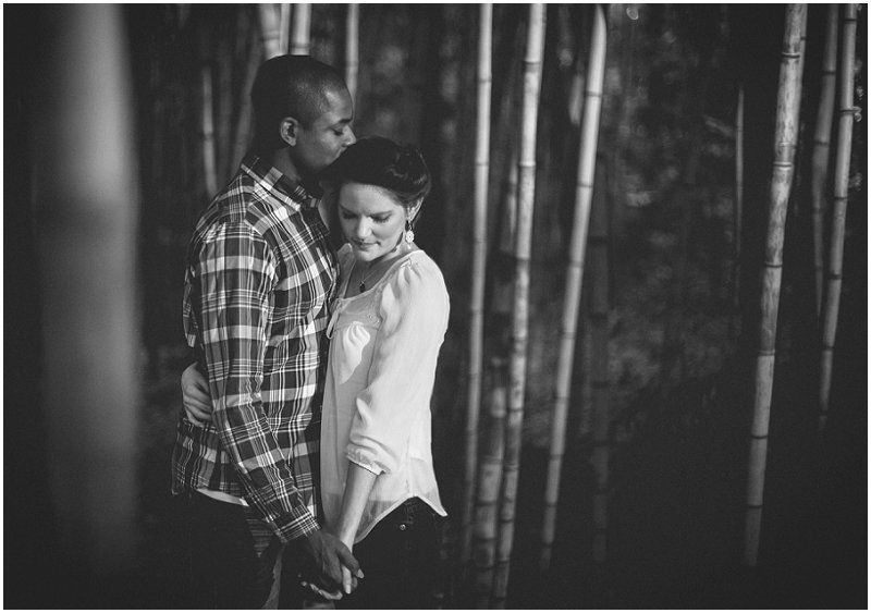 Kissing in the bamboo forest at the Duke Gardens during the engagement session at the Duke Gardens