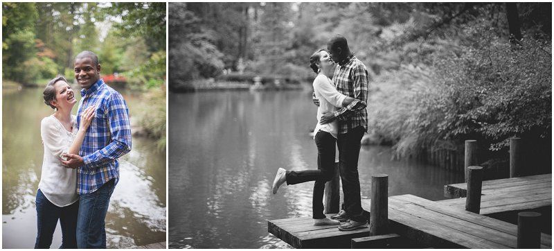 hugging and kissing on the plank bridge at the Duke gardens during the engagement session at the Duke Gardens