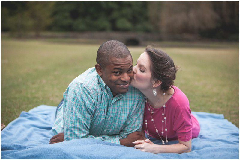 Duke gardens engagement session, kissing on the blanket