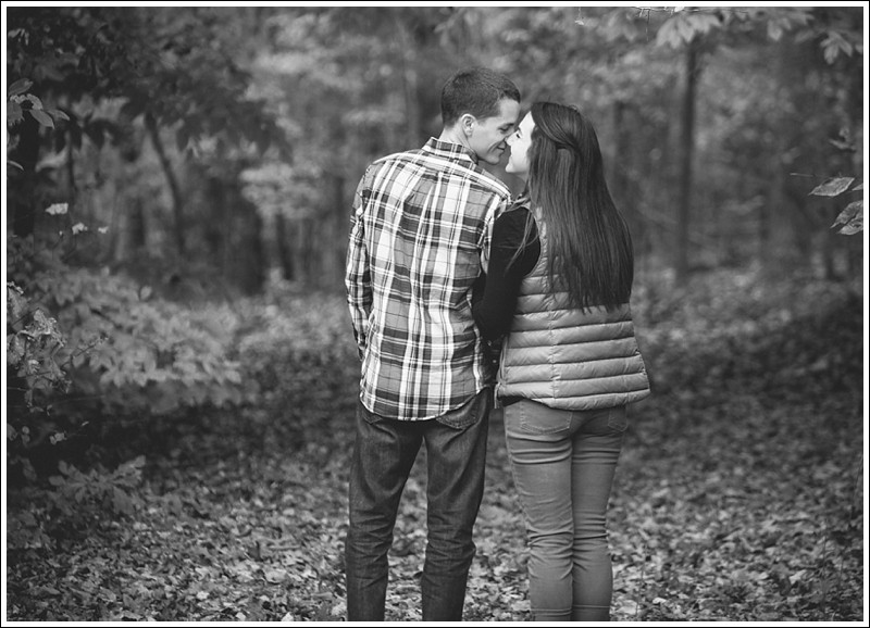 In the trees during the fall engagement session at reedy creek park in Charlotte North Carolina