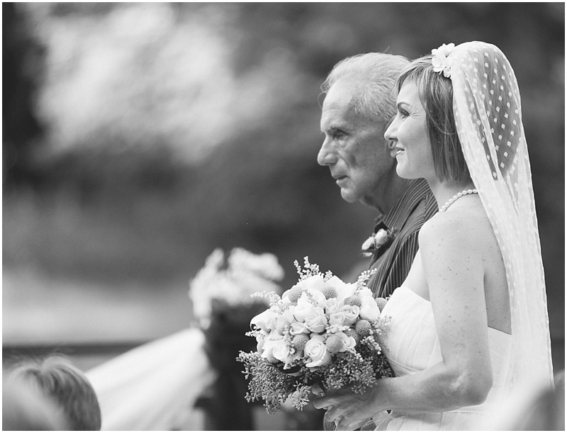 Father and daughter during the ceremony at the country chic DIY wedding in Tanglewood park Shelter 3 in Winston Salem Clemmons North Carolina