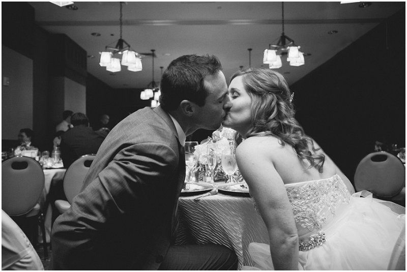 Bride and groom kissing during the reception at the Waterfront wedding at the chetola resort and spa in Blowing rock North Carolina