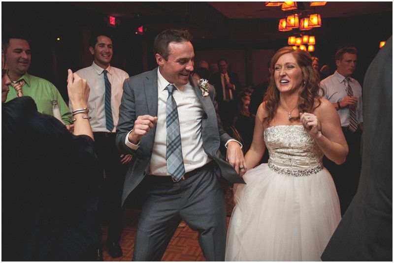 groom dancing with his wife during the reception at the Waterfront wedding at the chetola resort and spa in Blowing rock North Carolina