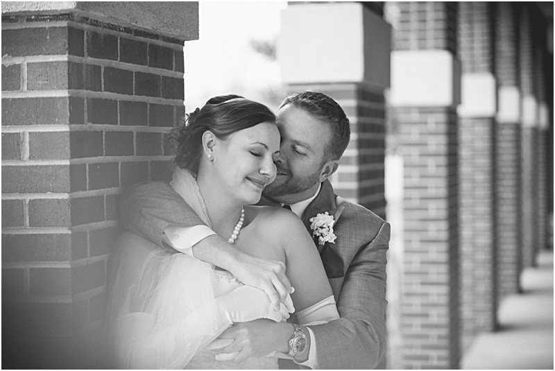Groom embracing his wife during the High Point North Carolina Wedding at First Baptist Church High Point and high point country club at Emerywood