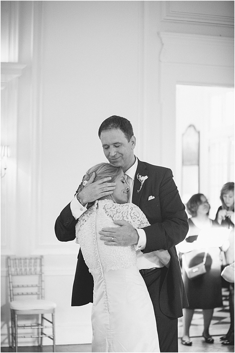 Groom holding the brie tight at the charlotte duke mansion wedding reception