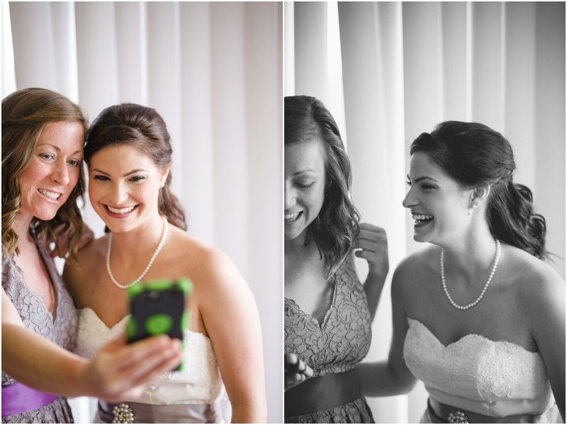 Bride and bridesmaid taking a selfie before the wedding at the Charleston Yacht Club during a destination wedding in Charleston South Carolina near the ocean