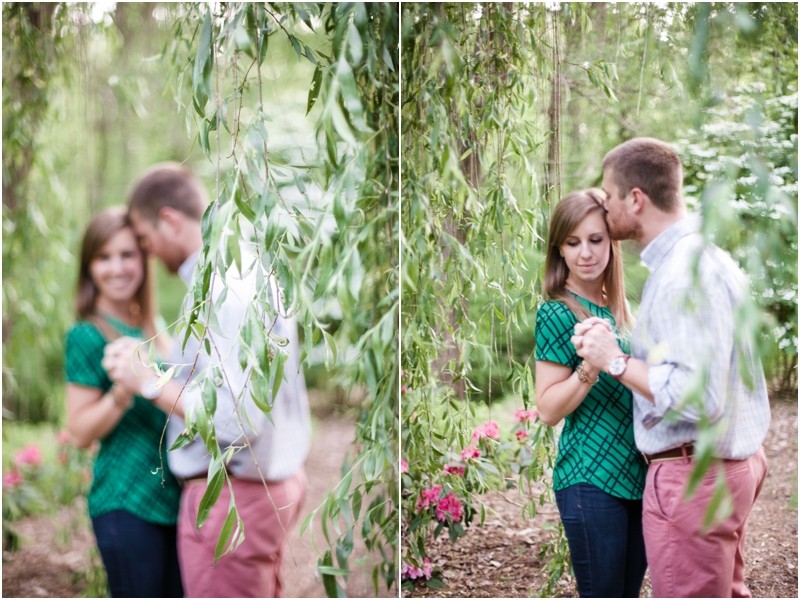in the weeping willow trees Andrew and Anna at the Engagement portraits at the Greensboro Bicentennial Gardens