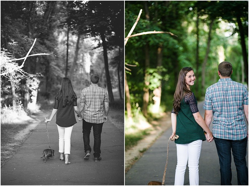 looking over her shoulder while walking the dog during the engagement session at burr mill park and the greensboro bicentennial gardens