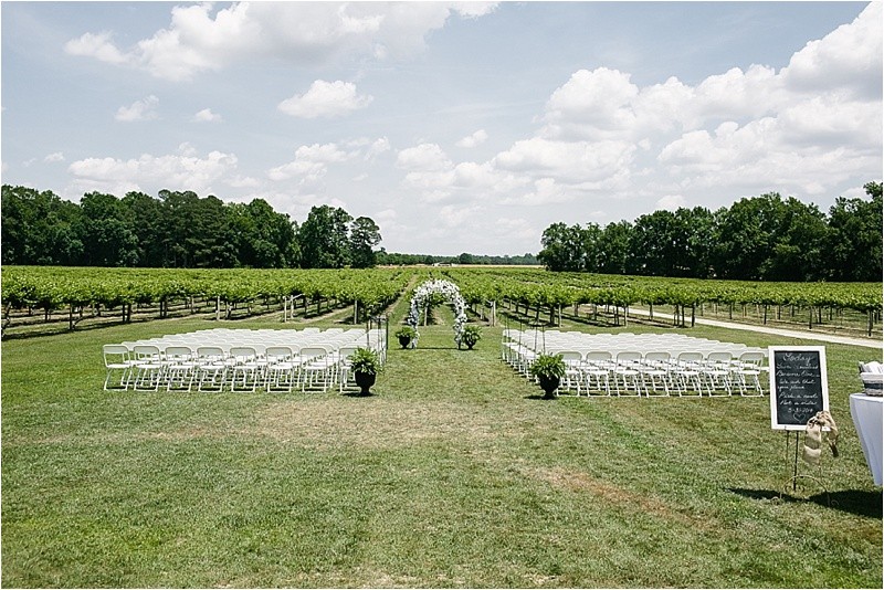 Wedding ceremony location in front of the vineyard during the vineyard wedding at the Hinnant Family Vineyard in Pine Level Nc near Raleigh