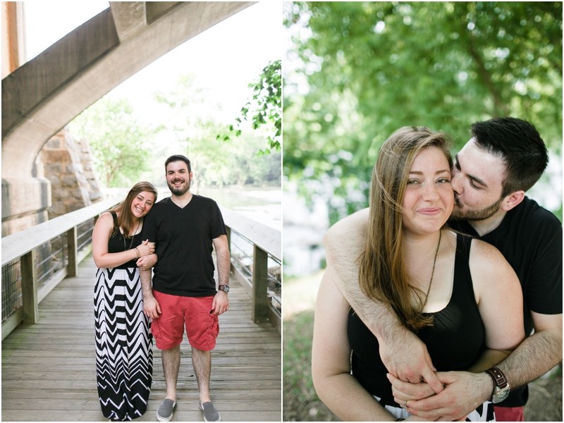Kissing and under the bridge at the Three River Greenway in Columbia South Carolina During their engagement session
