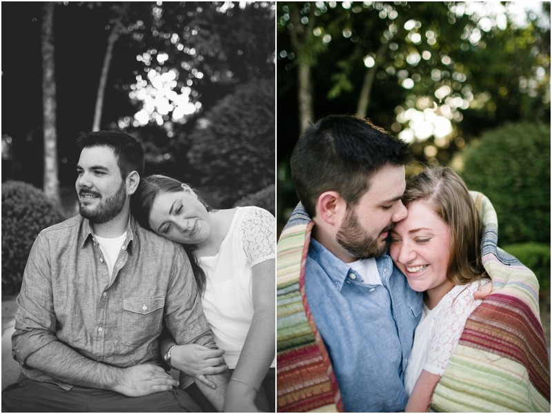 Sitting and cuddling in the amphitheater in the blanket at the Three River Greenway in Columbia South Carolina During their engagement session