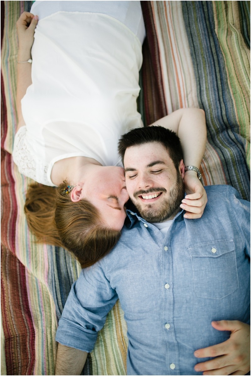 Laying on the blanket at the Three River Greenway in Columbia South Carolina During their engagement session