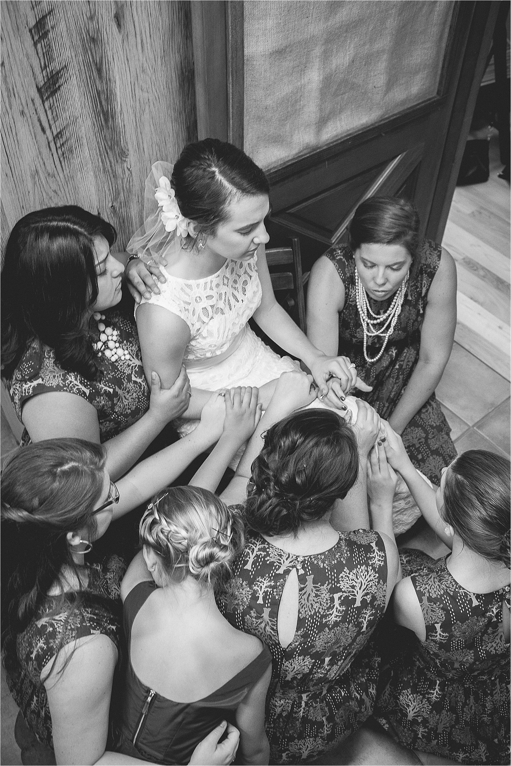 Bridesmaids praying for the bride at Caroline and Evans mountain wedding at yesterday spaces in asheville leicester north caroline