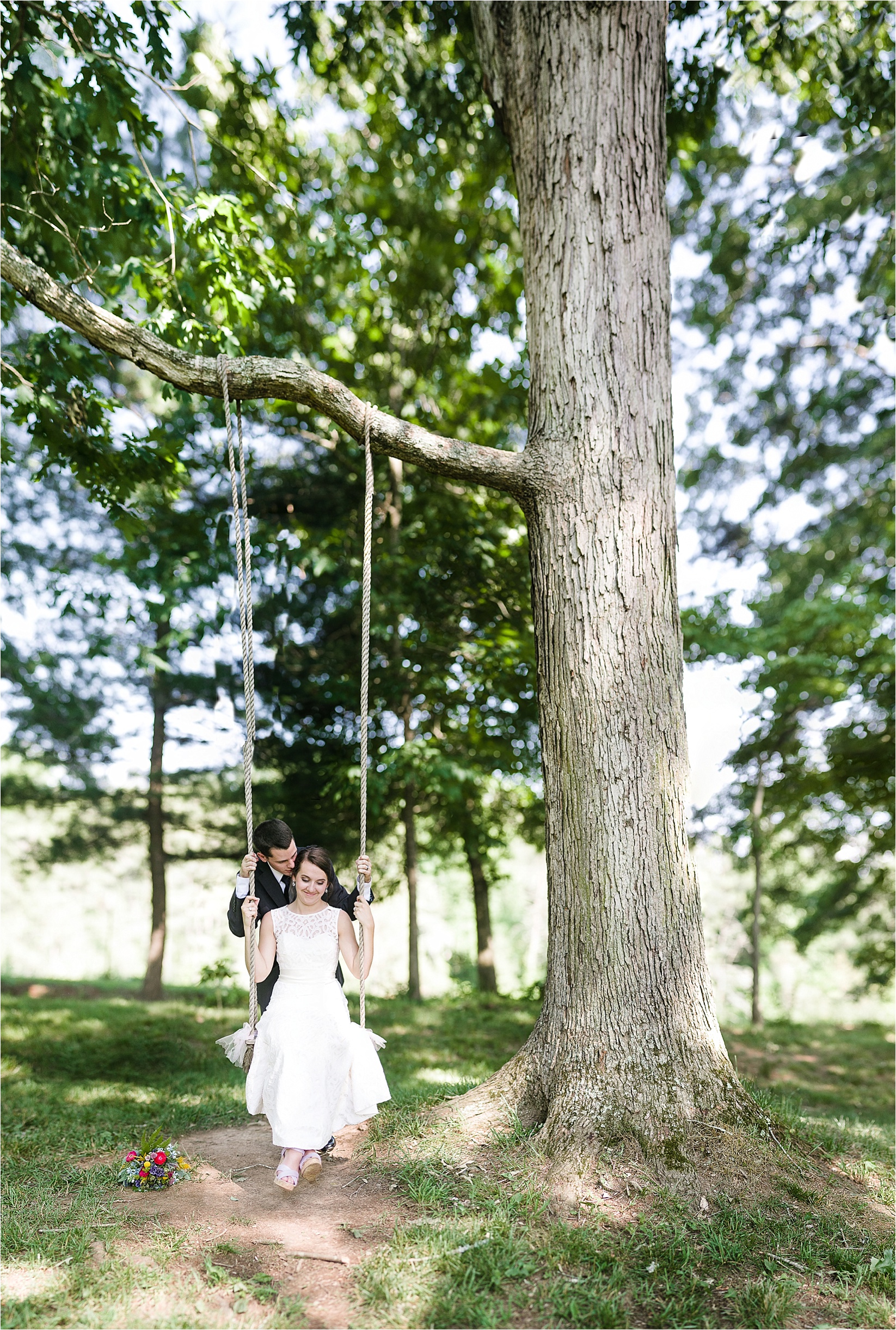 brenizer method on the swing at Caroline and Evans mountain wedding at yesterday spaces in asheville leicester north carolina