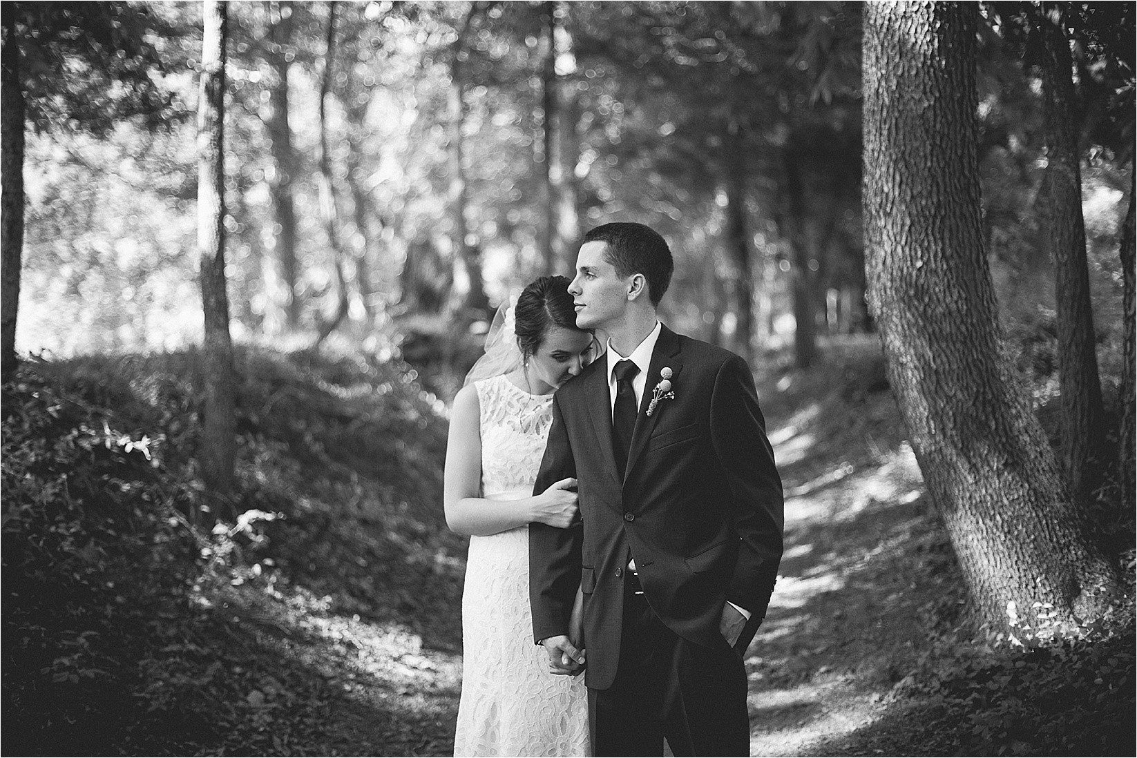 Groom looking off in the distance at Caroline and Evans mountain wedding at yesterday spaces in asheville leicester north carolina