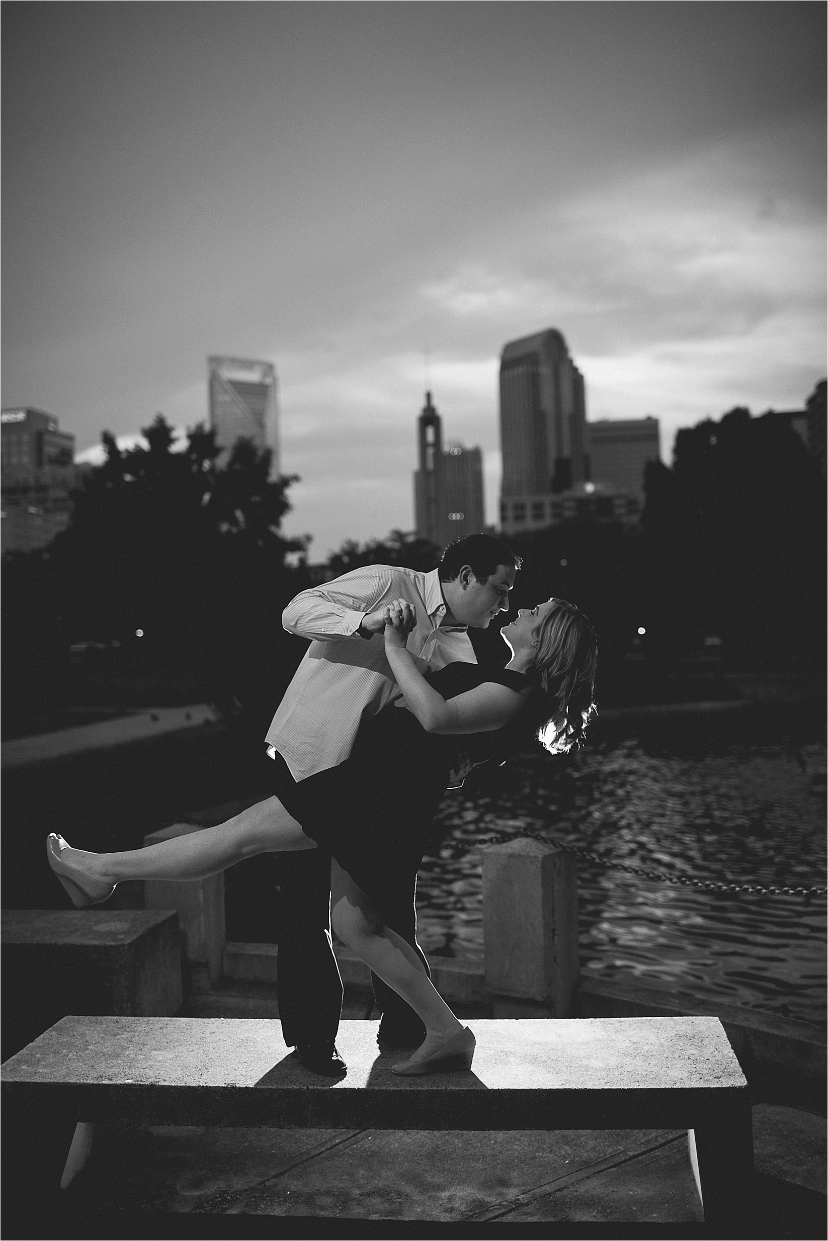 Black and white charlotte skyline at Catherine & Jordan's engagement session at freedom park and marshall park in Charlotte North Carolina
