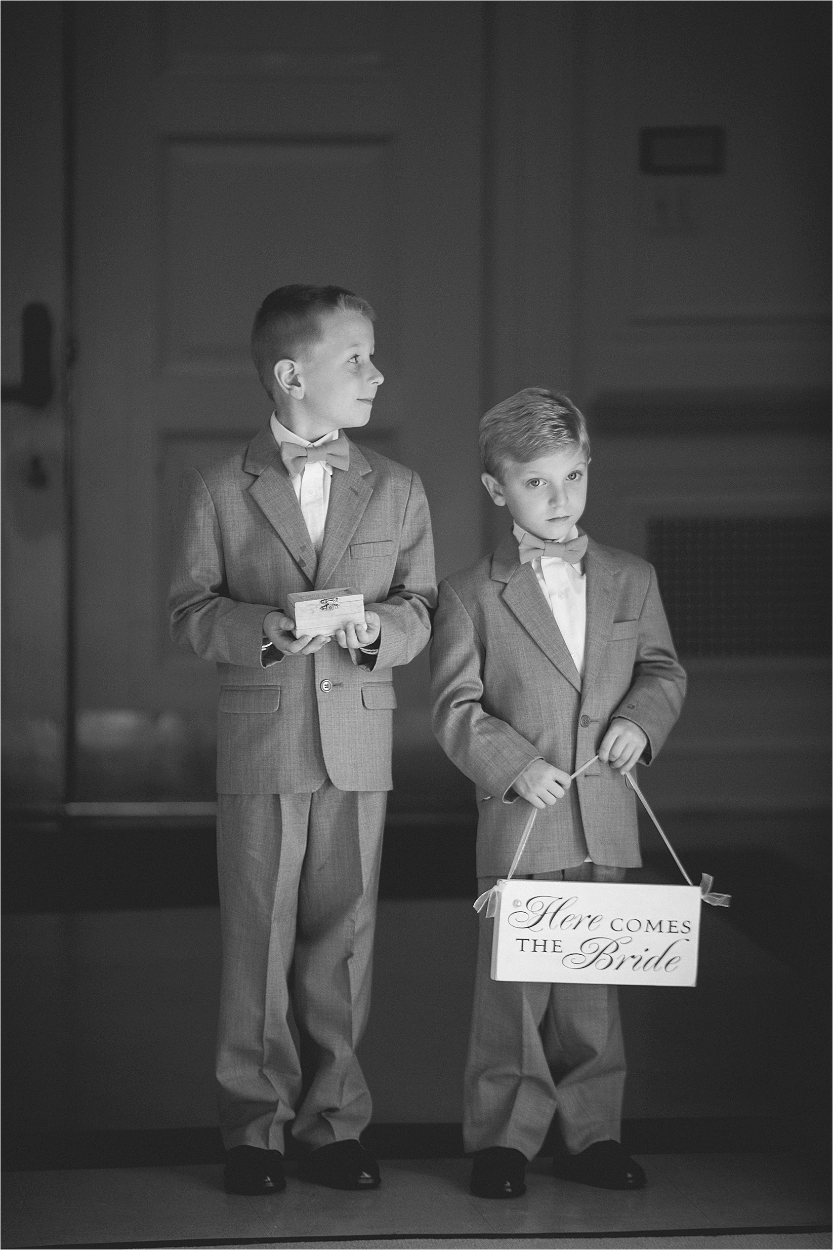 hears comes the bride sign from the ring bearers at the davidson college chapel wedding in Davidson north Carolina and the Charles mack citizen center wedding and reception