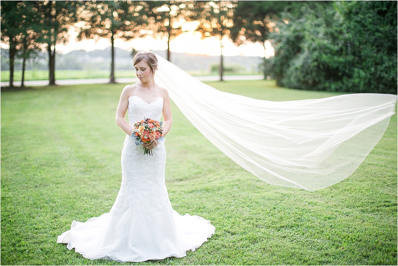 Flying veil in the wind during anna's beaver dam bridal session in davidson north carolina nc