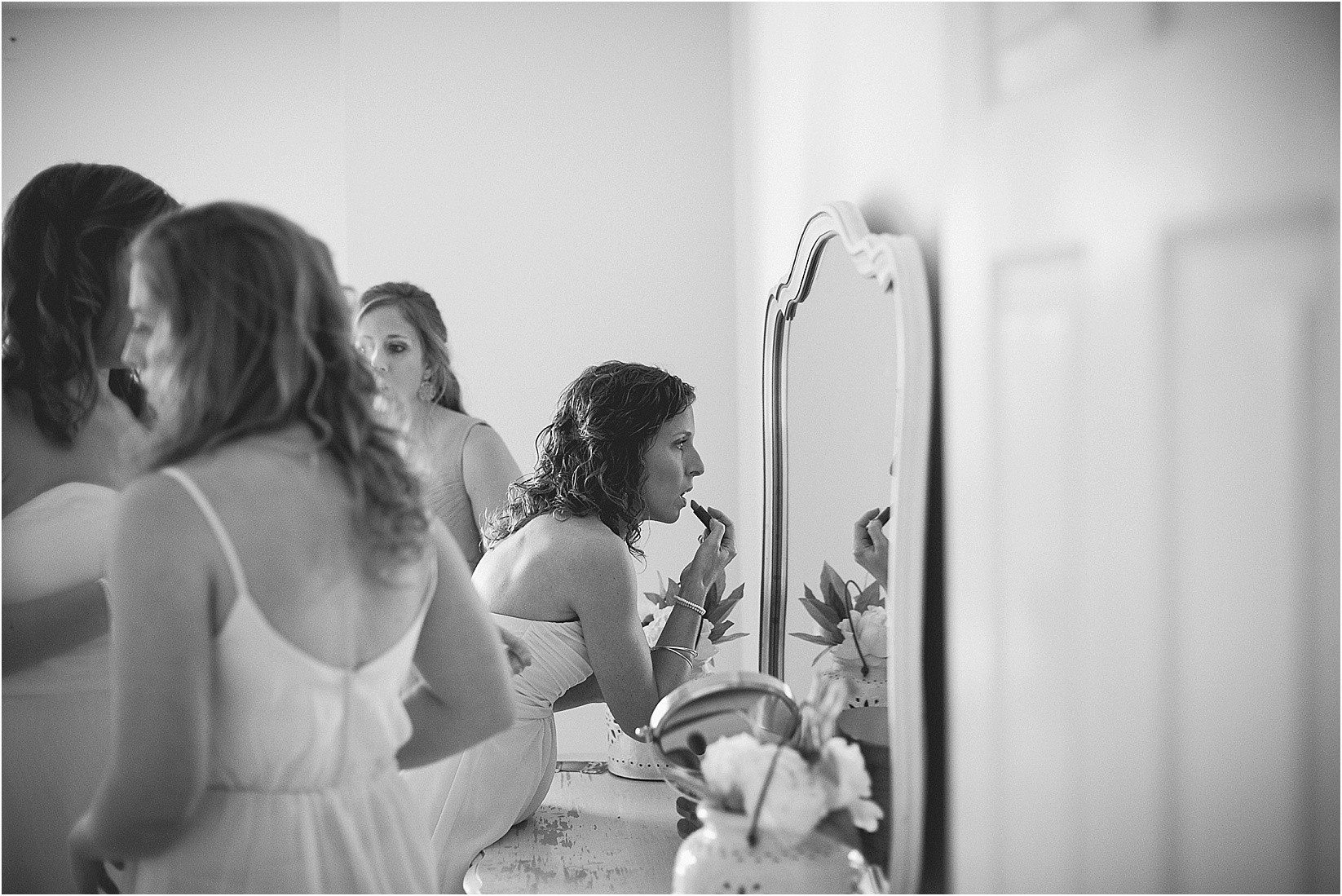putting make up on during their wedding at the Historic Rural Hill wedding ceremony and reception in Huntersville nc