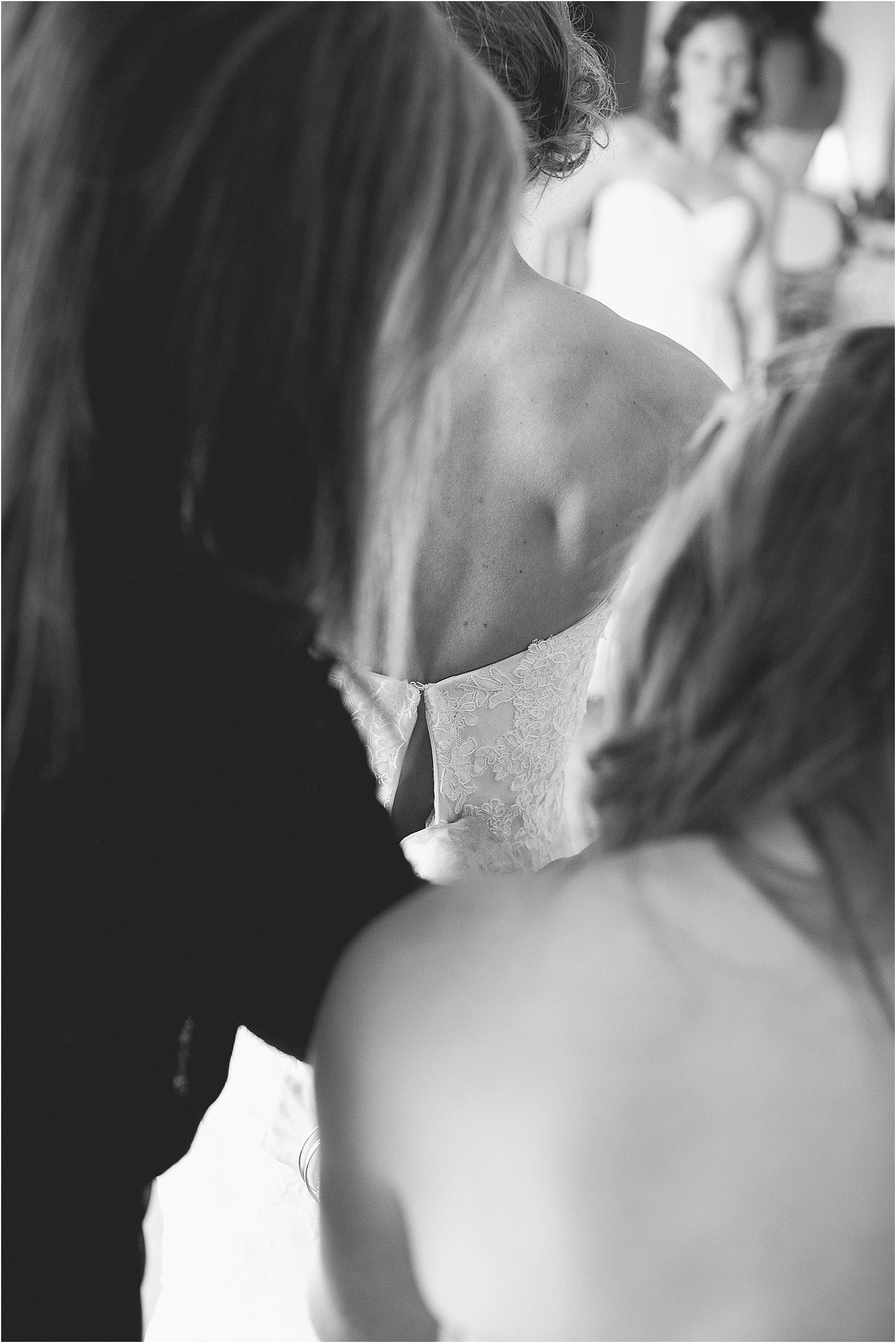 the back of the dress during their wedding at the Historic Rural Hill wedding ceremony and reception in Huntersville nc