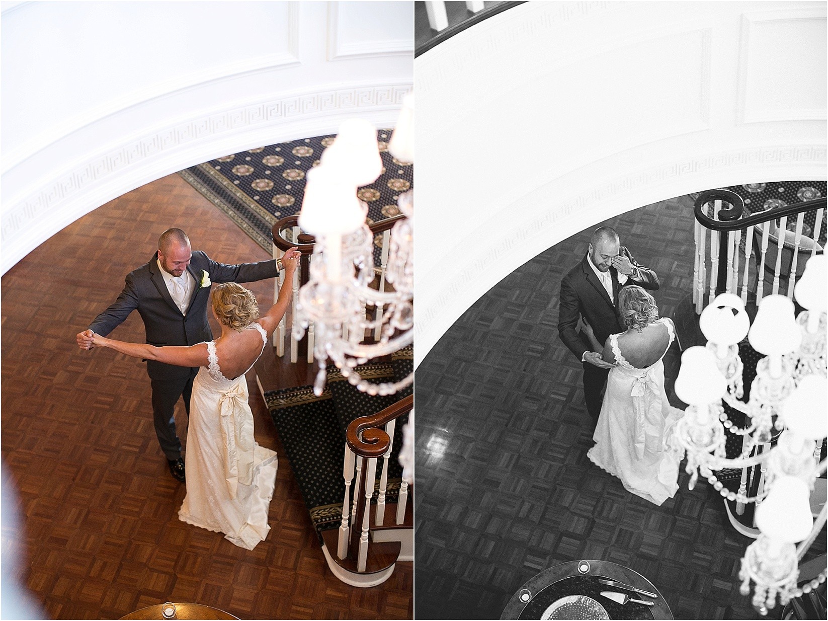 Birds eye view of the first look on the stairs the Charlotte City Club wedding in charlotte North Carolina