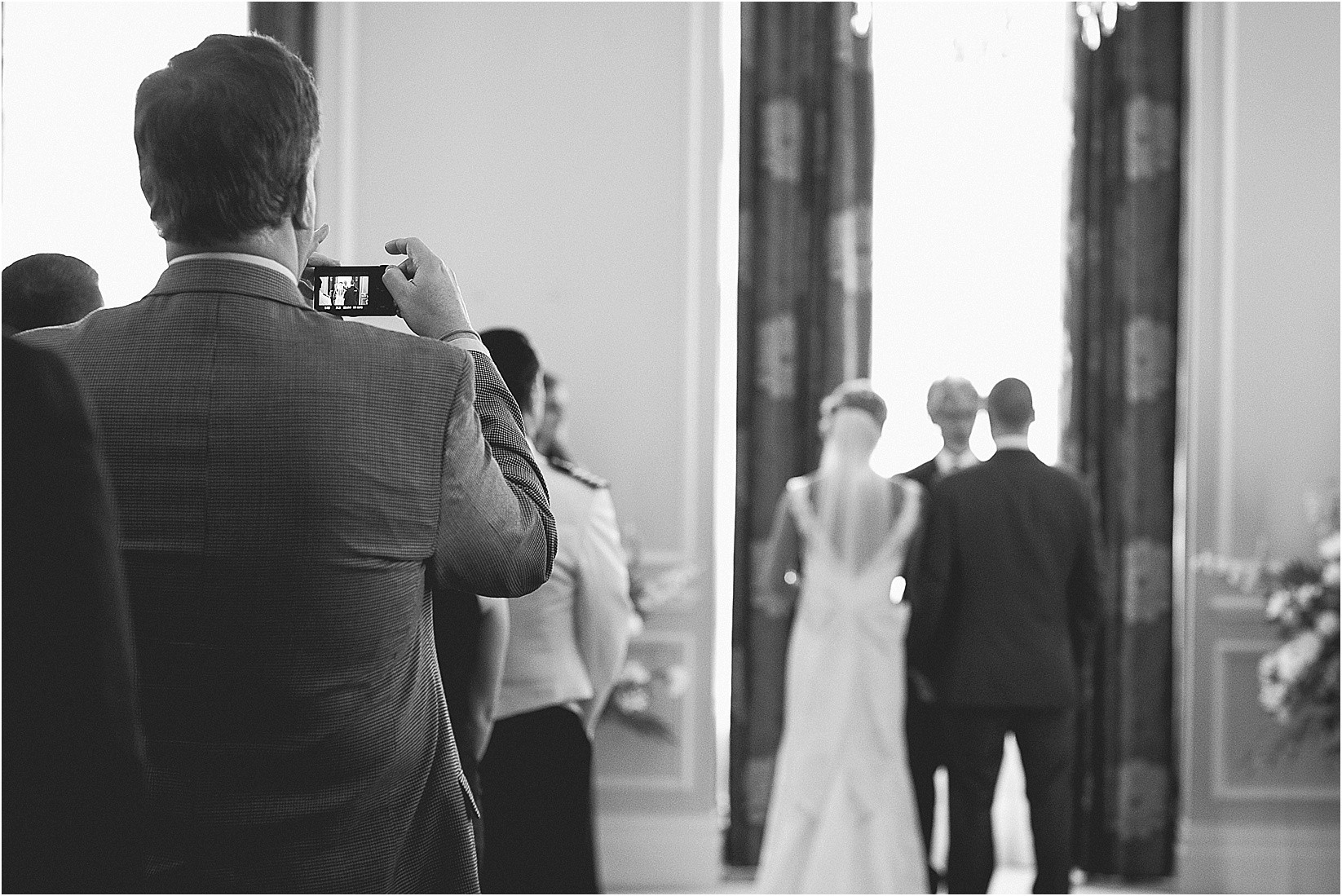 Guests taking photos at the Charlotte City Club wedding in charlotte North Carolina