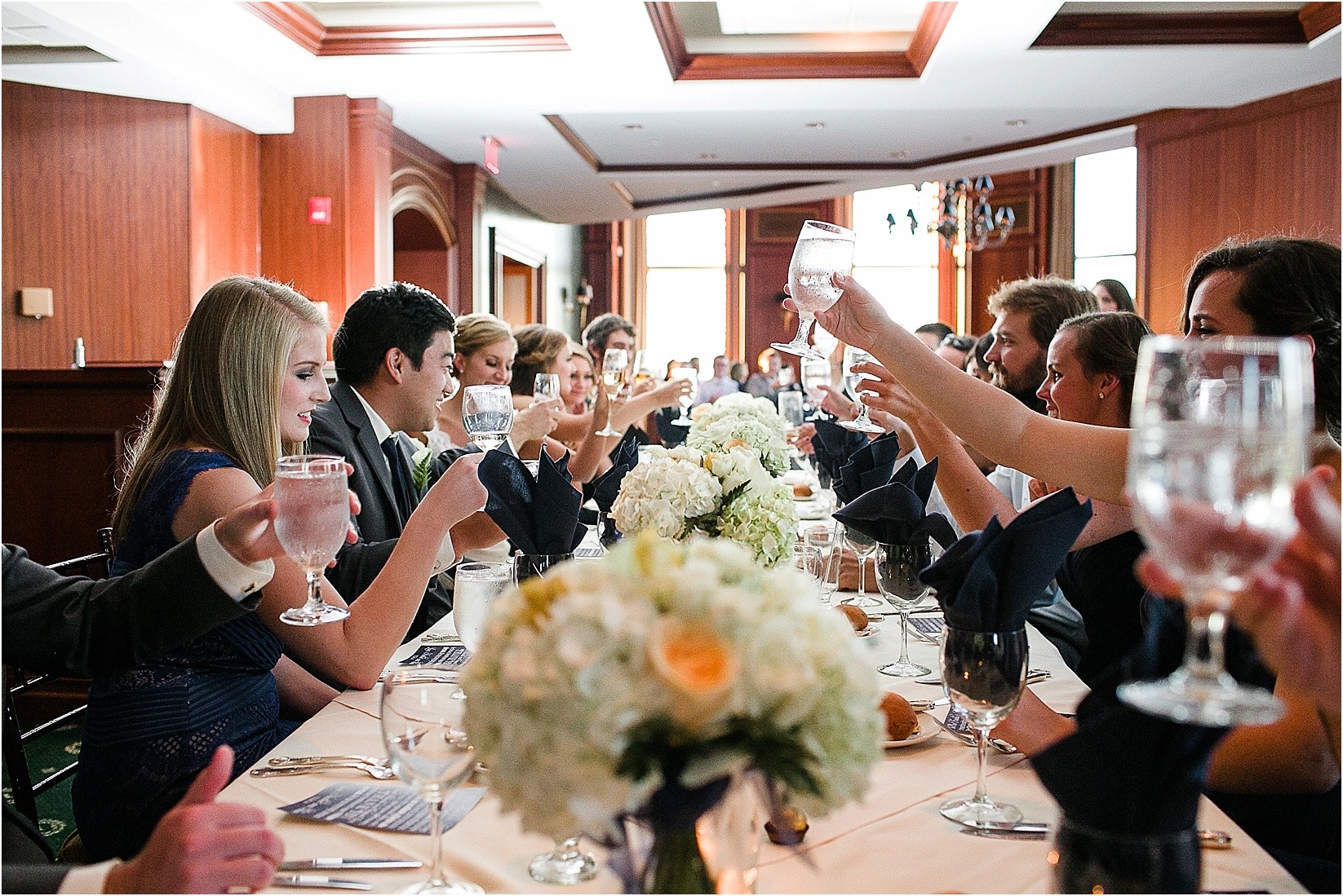 Toasting to the couple at the Charlotte City Club wedding in charlotte North Carolina