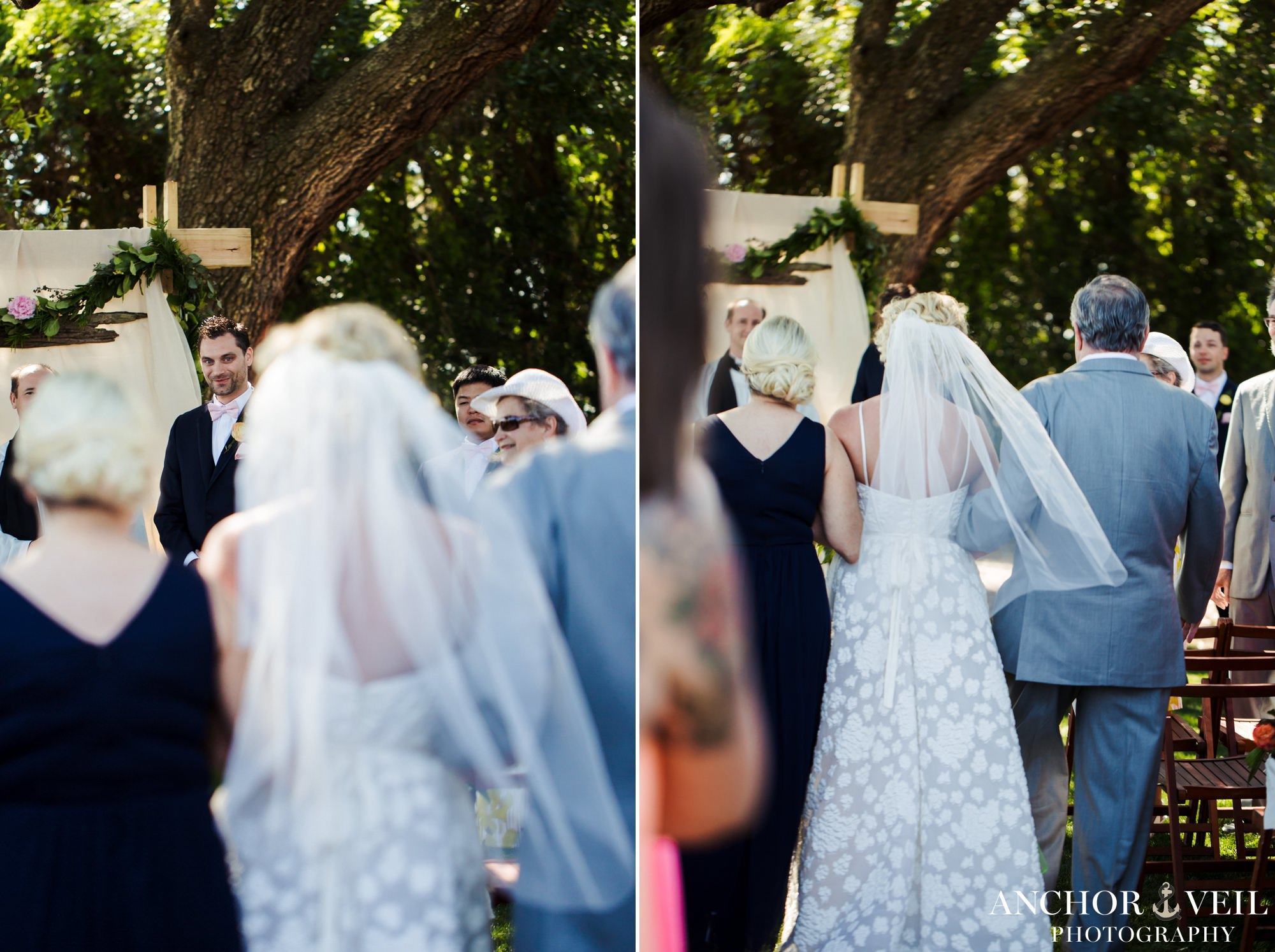 groom looking at his bride walk down the aisle
