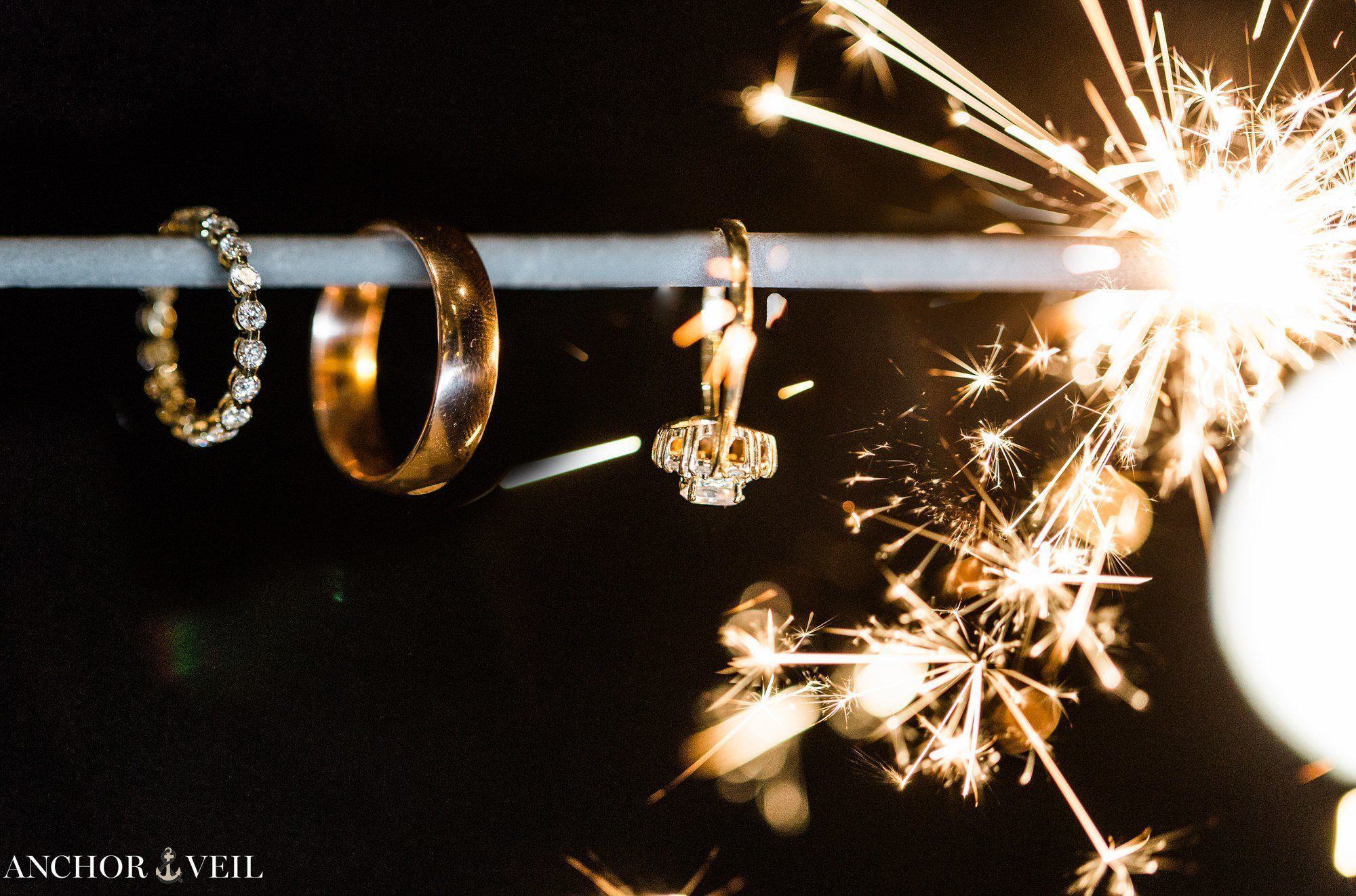 rings with sparklers lighting them up