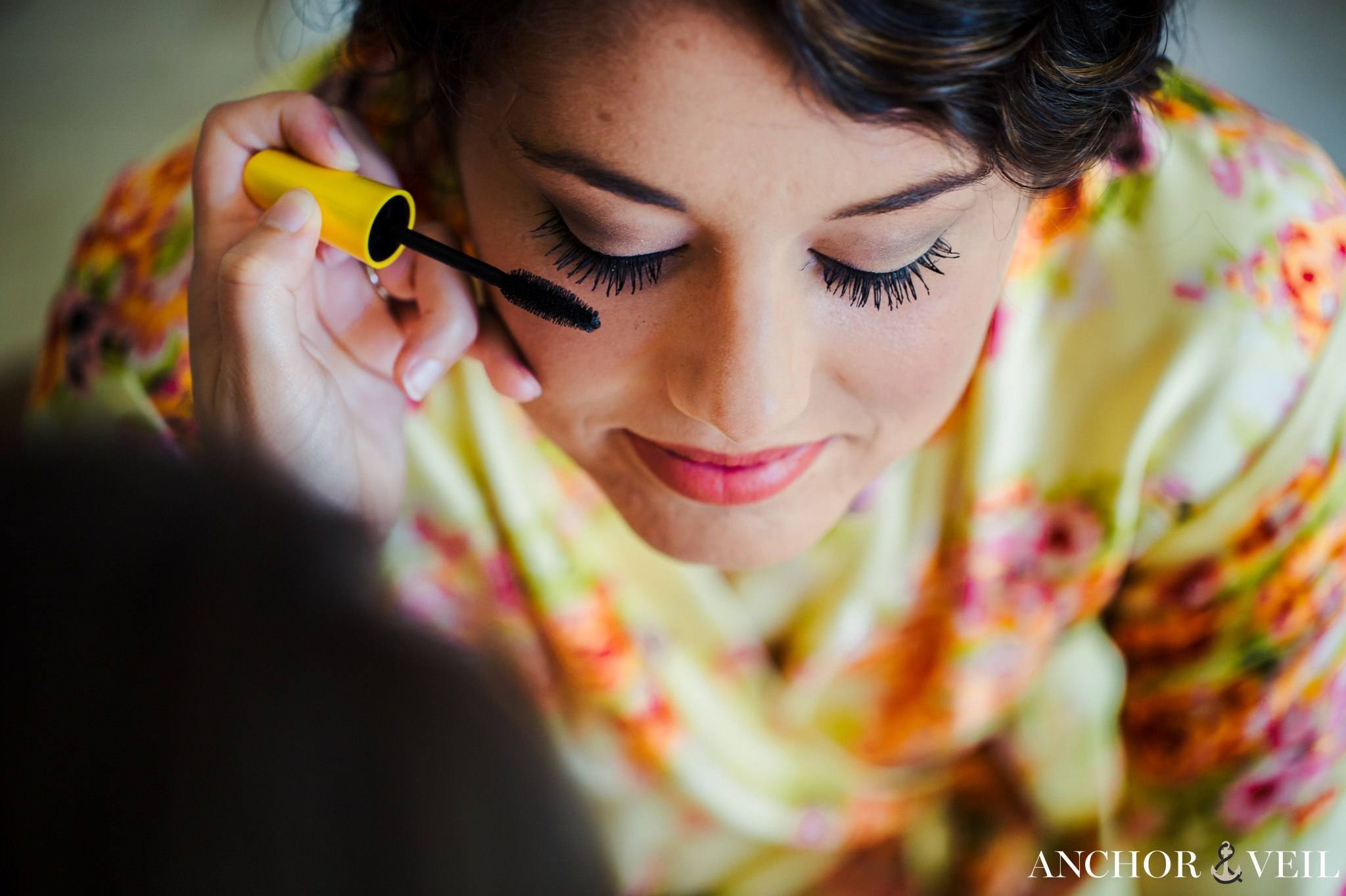 bride getting mascara on from above