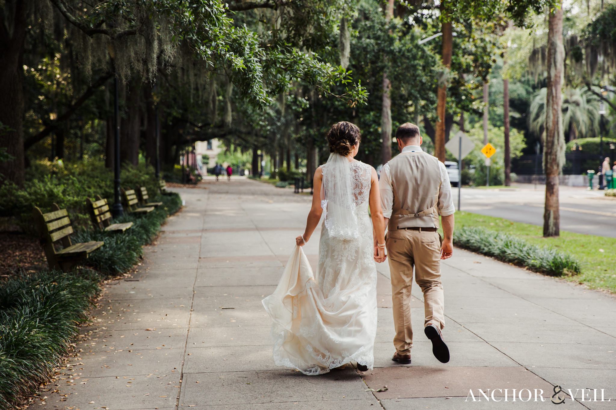 walking to the park together during their Forsyth Park Wedding Elopement