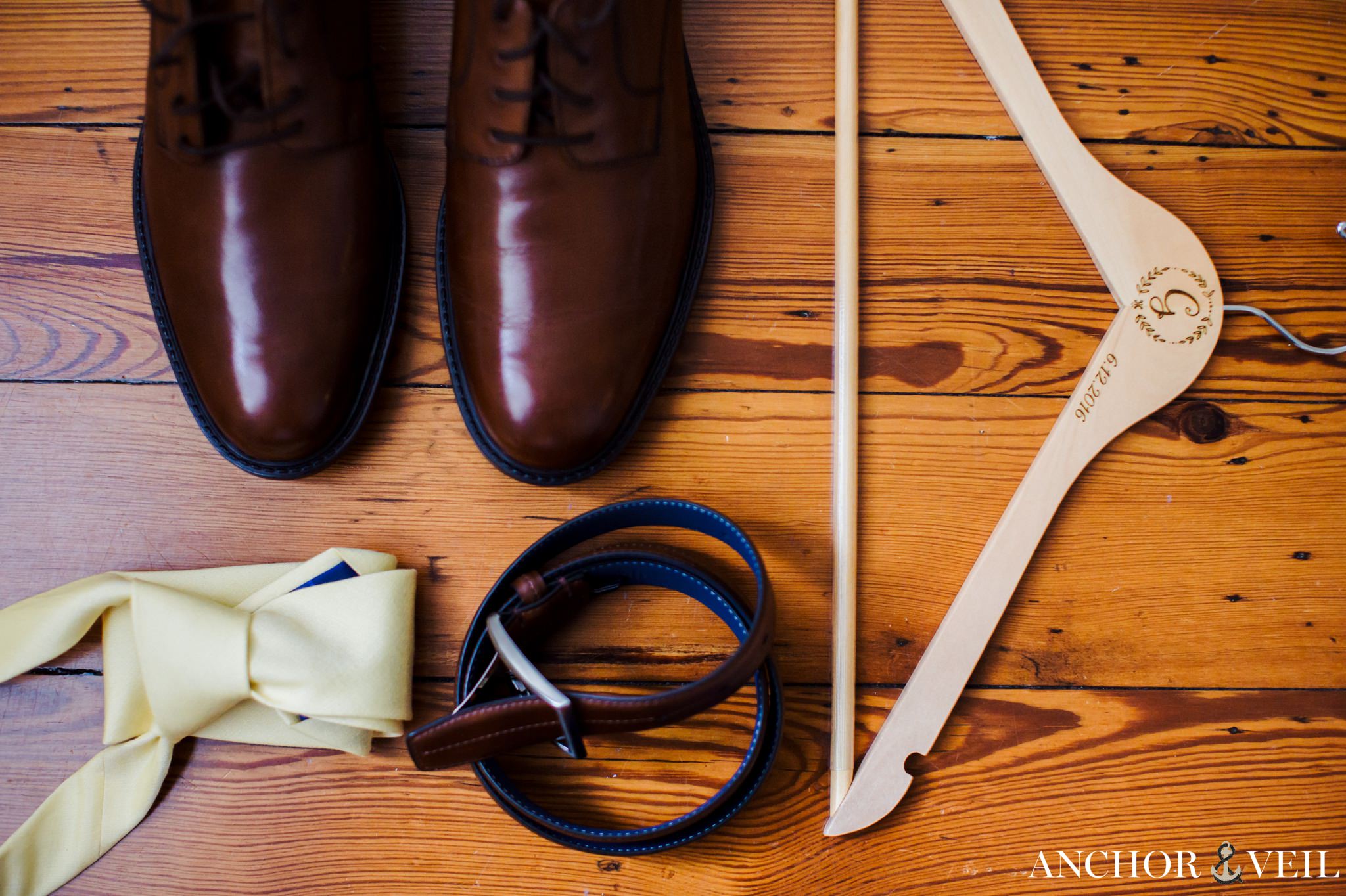 grooms details, hanger shoes belt and tie during their Forsyth Park Wedding Elopement