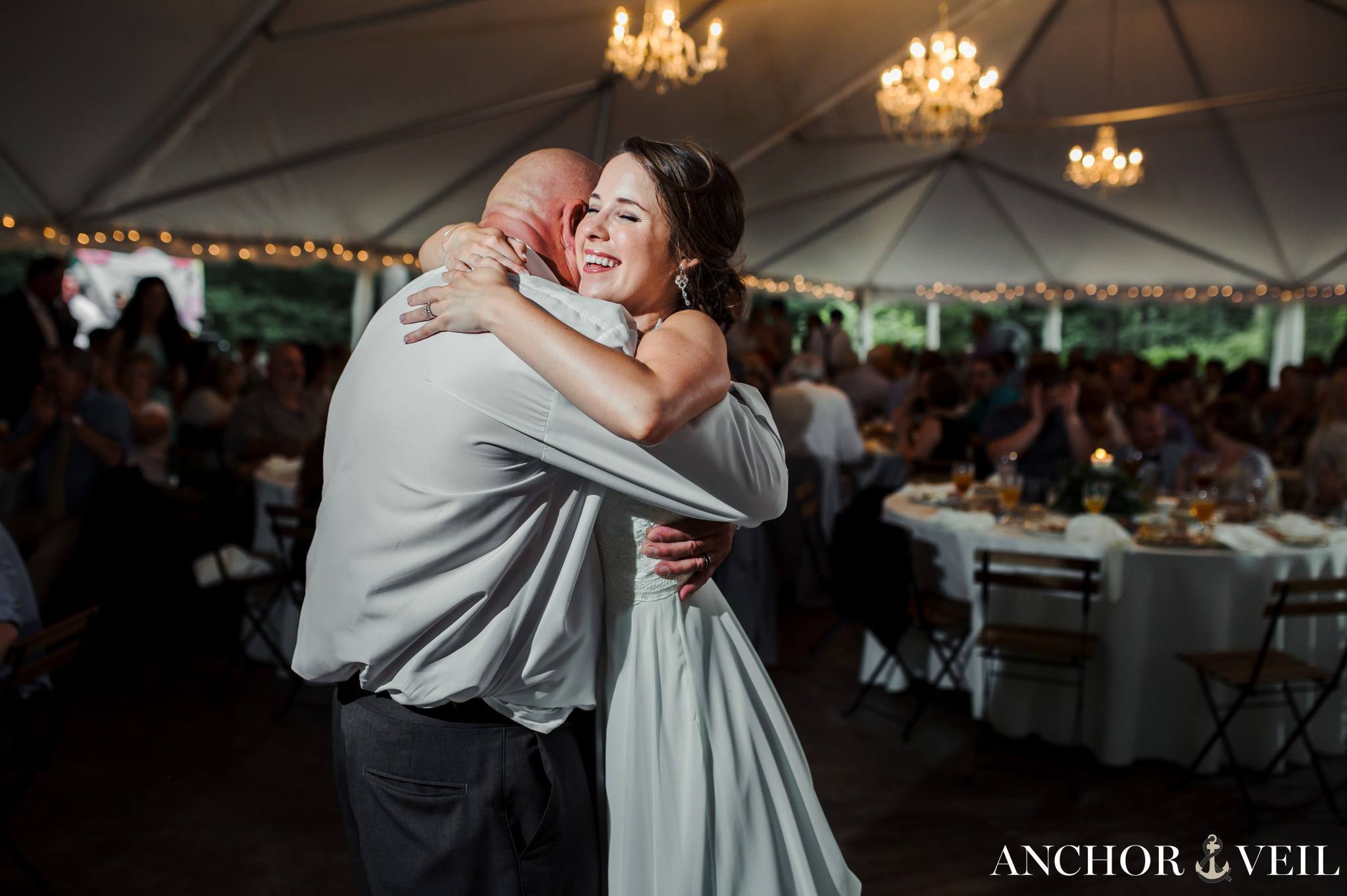 bride hugging dad during their dance