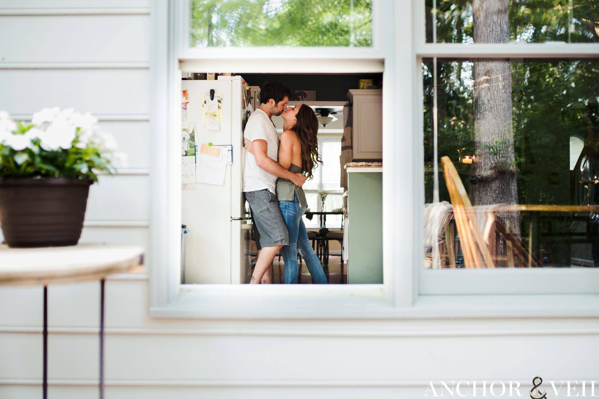 through the window kissing against the fridge