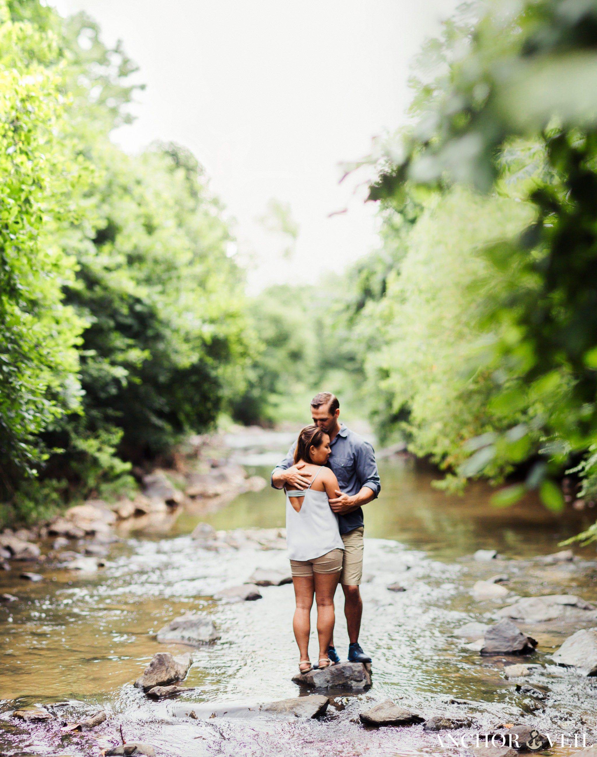 Brenizer method on the rocks in the middle of the river during their Freedom Park Engagement Session