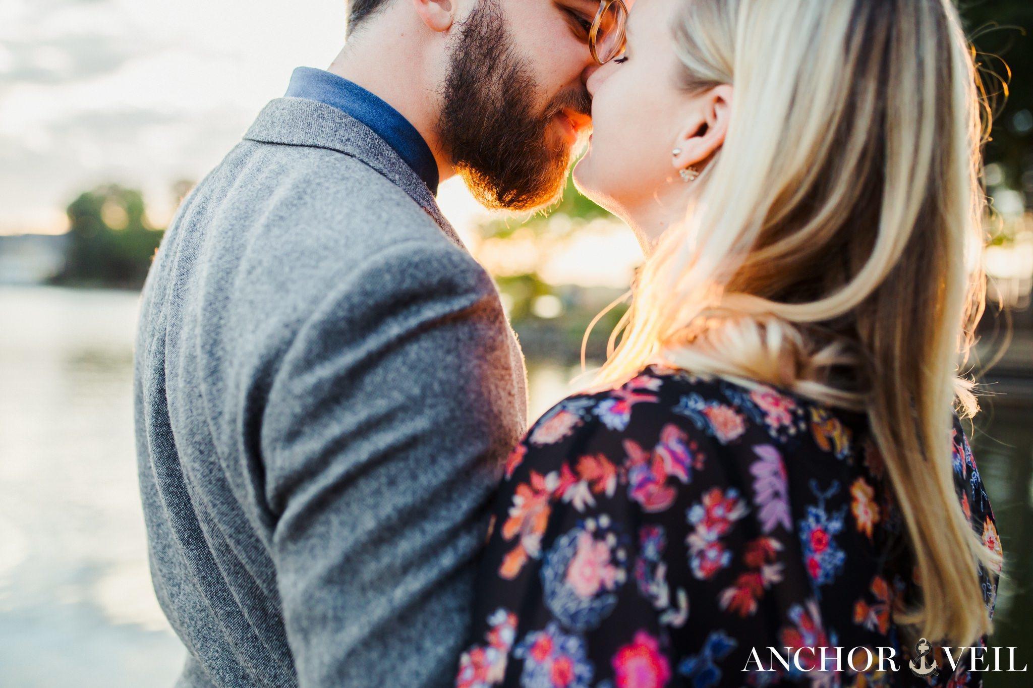 These lovers almost kissing in the light during their McDowell Nature Preserve Engagement Session
