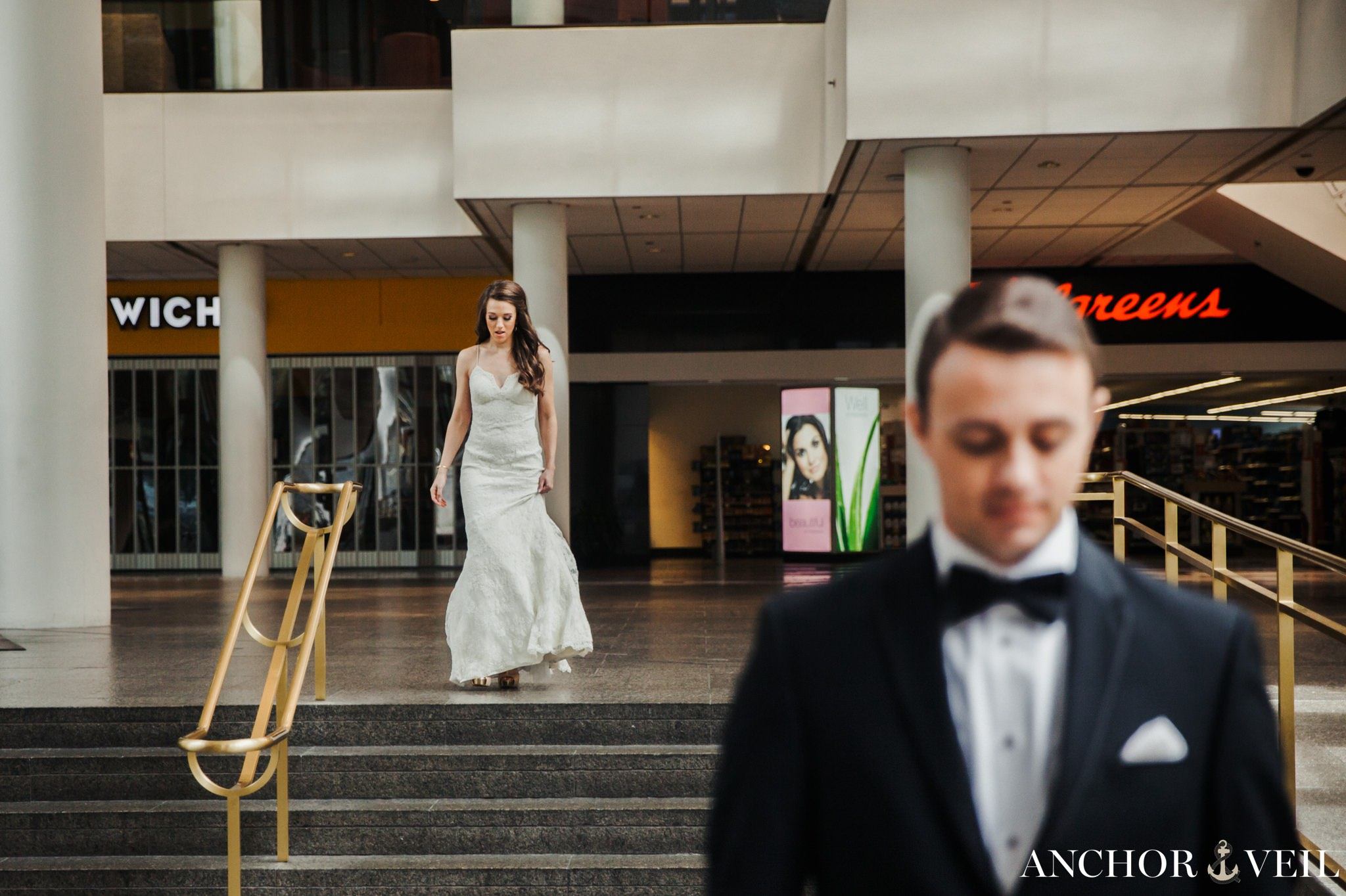 bride walking up behind the groom