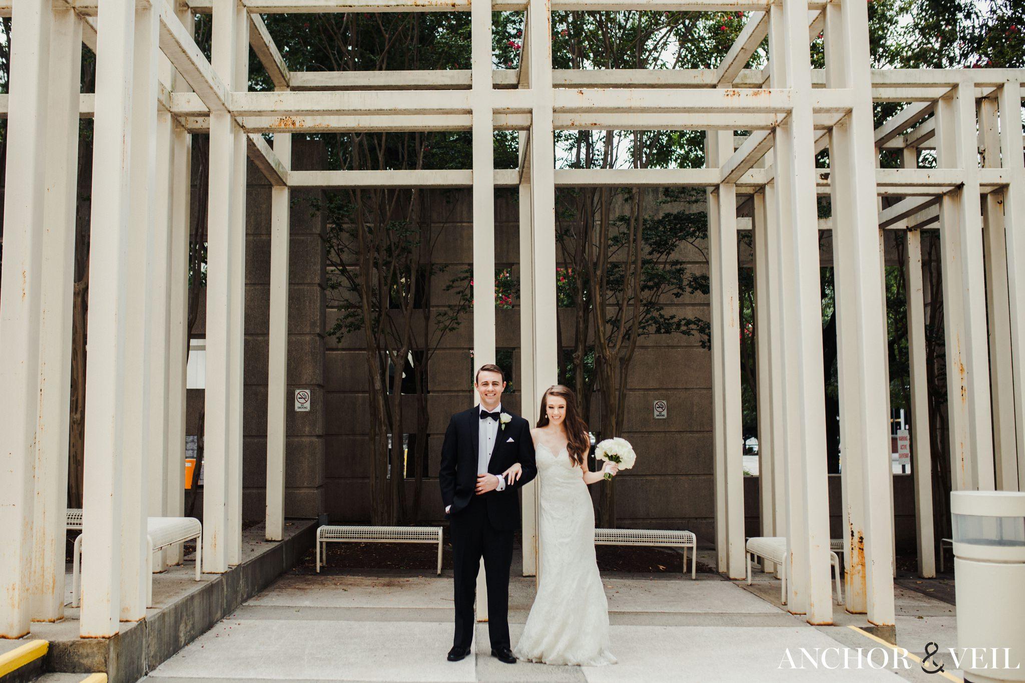 bride and groom with the lines in uptown charlotte