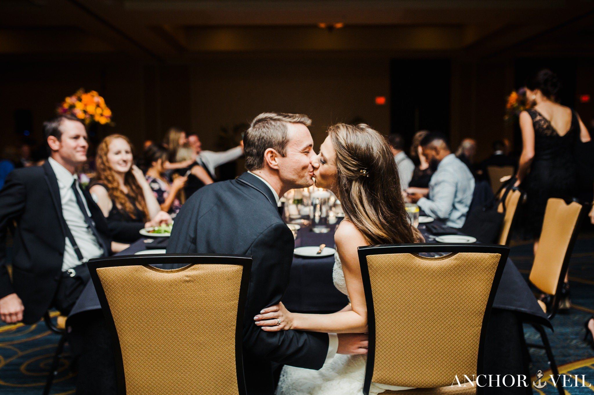bride and groom kissing during the reception