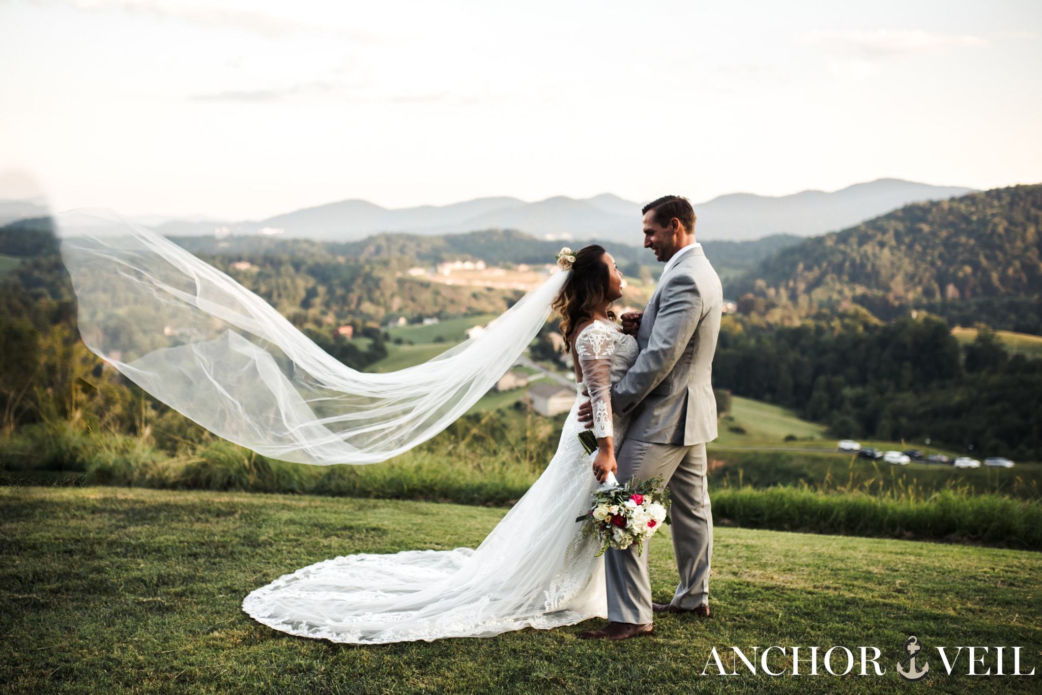 bride withs he veil in the air asheville mountains destination wedding