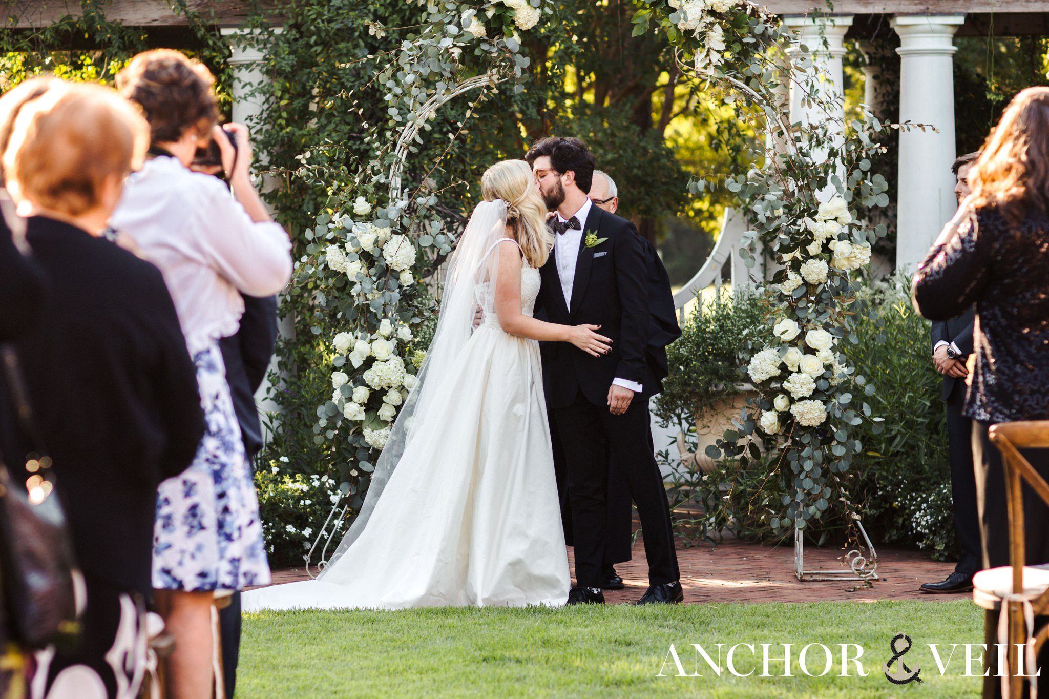 first kiss during the ceremony at Daniel Stowe Botanical Garden