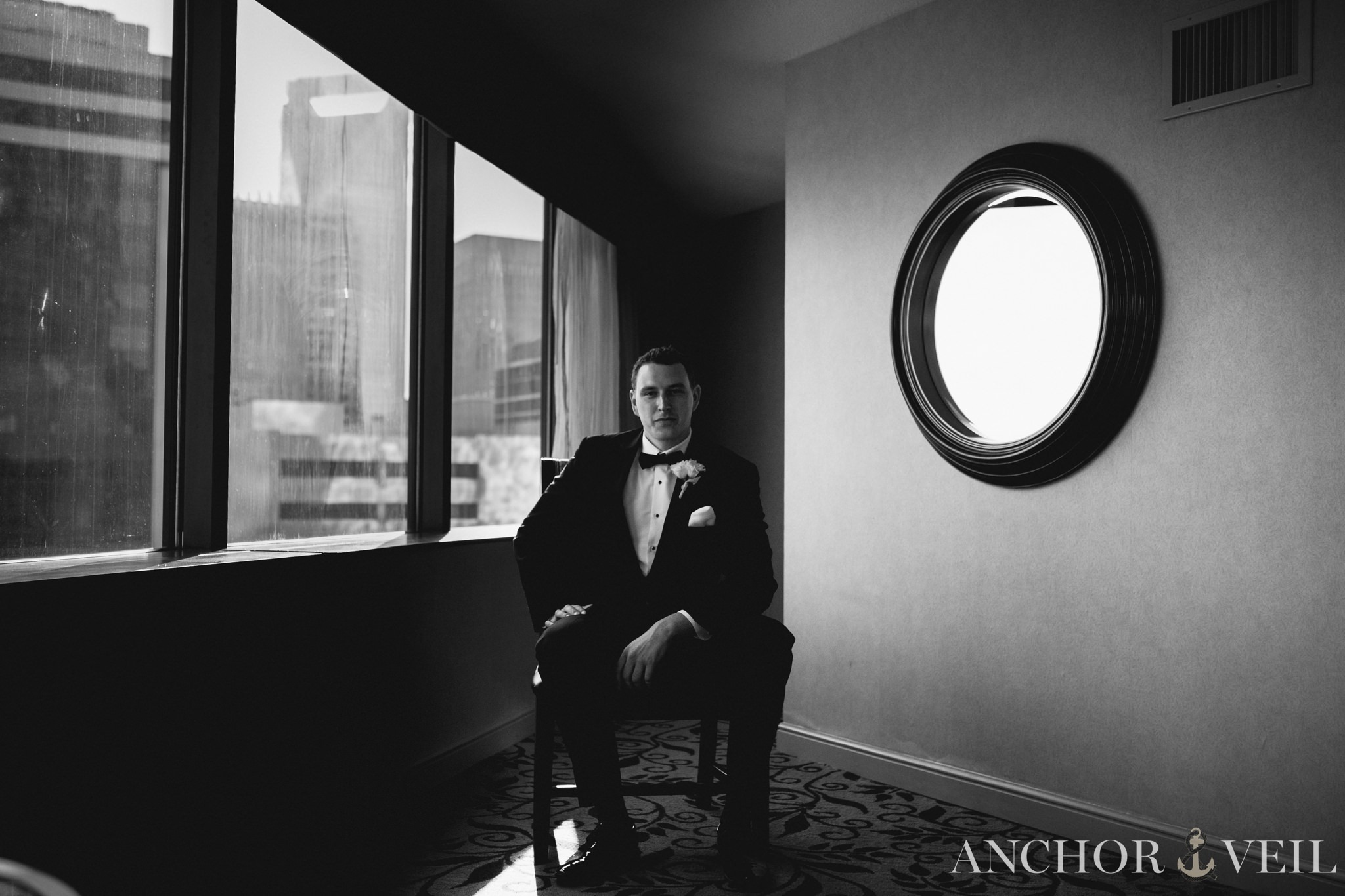 groom getting ready in uptown charlotte in black and white