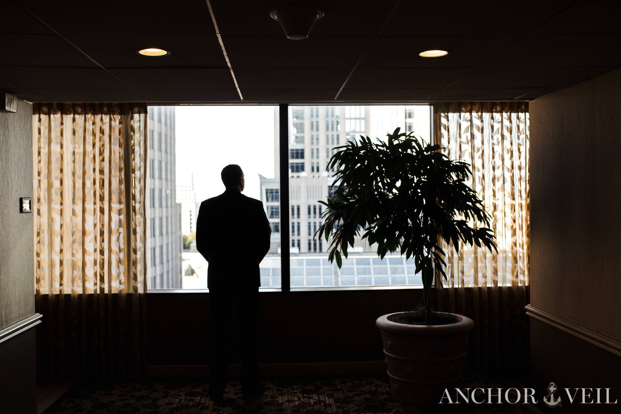 groom looking out to the skyline