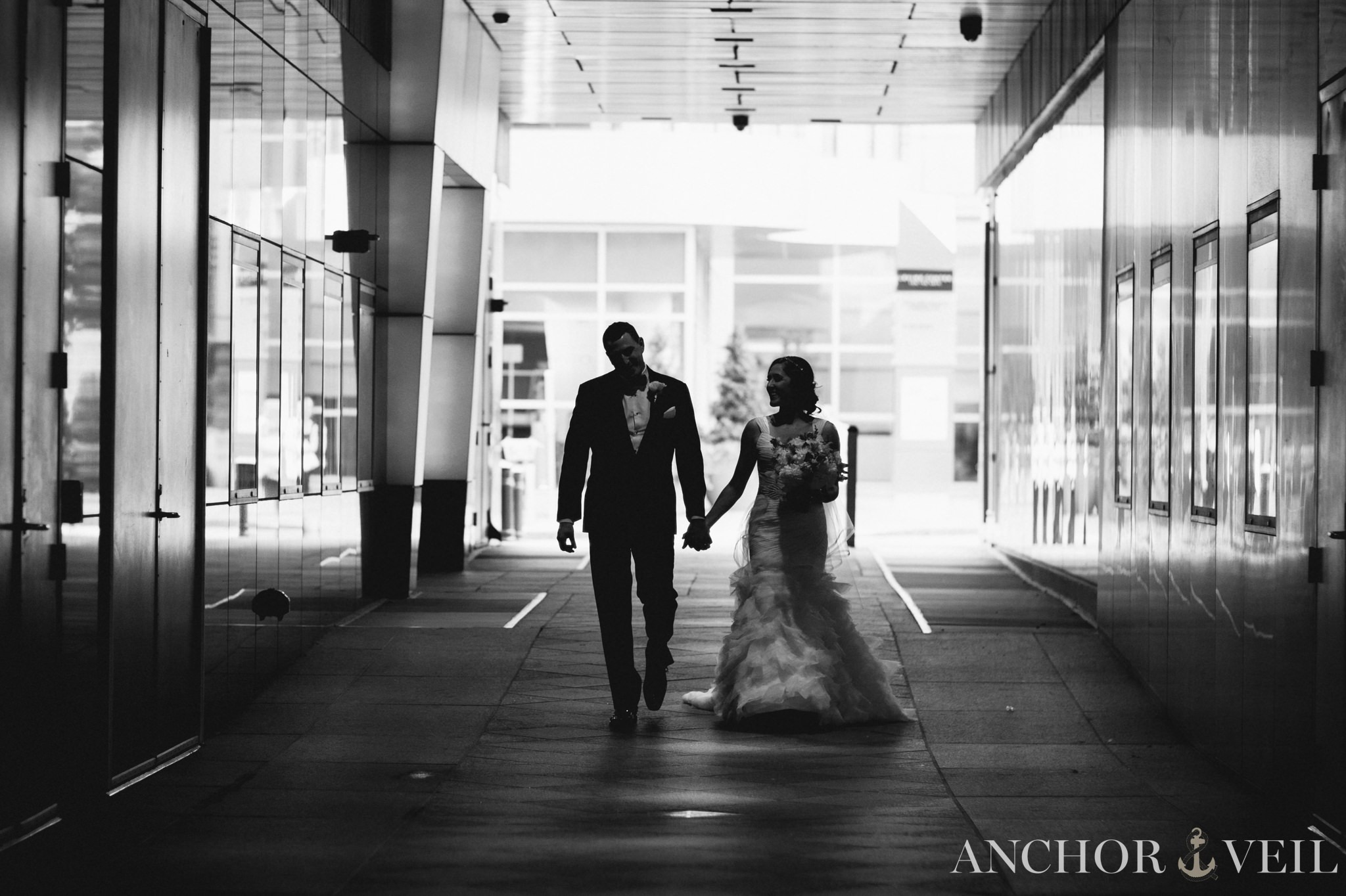 bride and groom walking in the hall